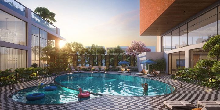 Swimming pool area with landscaped surroundings and seating spaces in a residential community